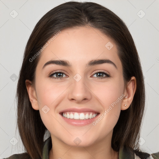 Joyful white young-adult female with medium  brown hair and brown eyes