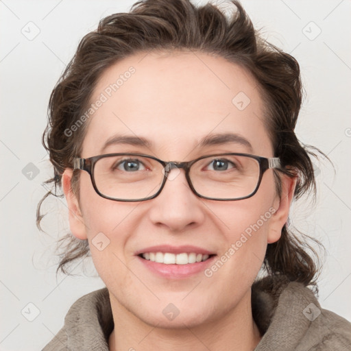 Joyful white young-adult female with medium  brown hair and blue eyes