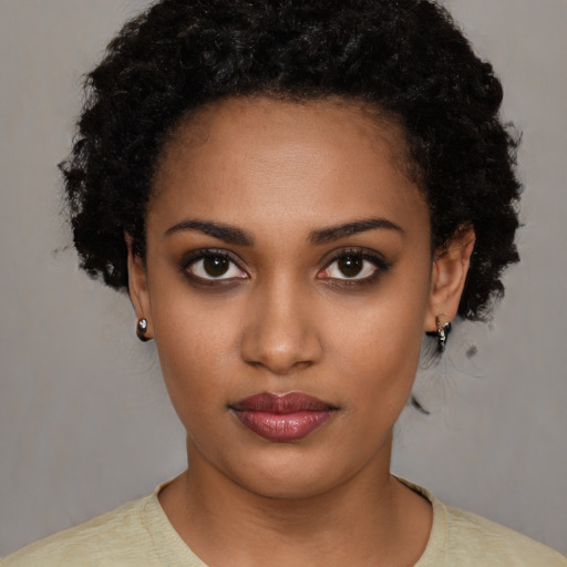 Neutral black young-adult female with short  black hair and brown eyes