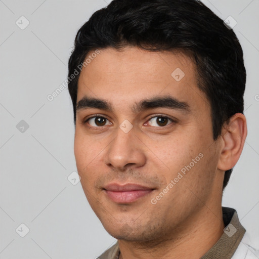 Joyful white young-adult male with short  black hair and brown eyes