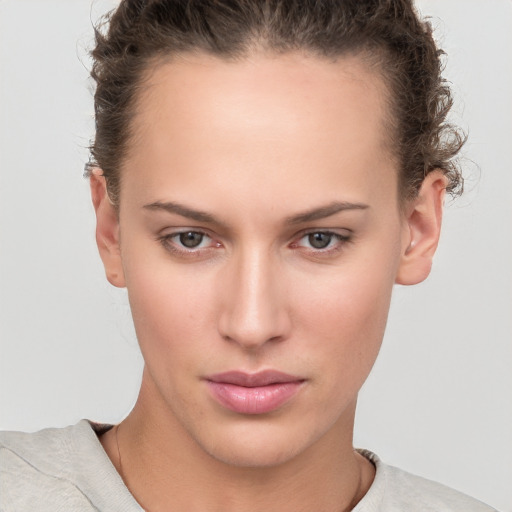 Neutral white young-adult female with short  brown hair and brown eyes