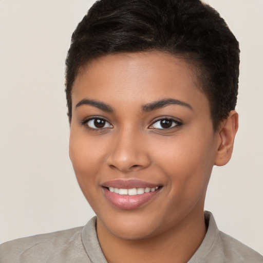 Joyful latino young-adult female with short  brown hair and brown eyes