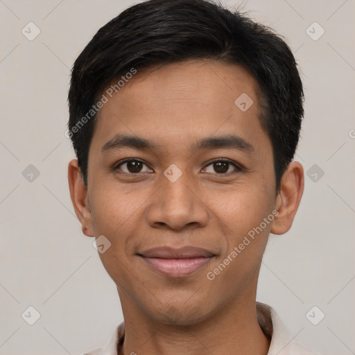 Joyful latino young-adult male with short  black hair and brown eyes