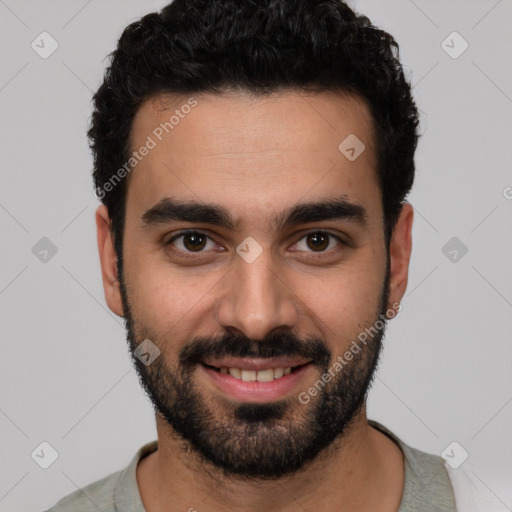 Joyful white young-adult male with short  black hair and brown eyes