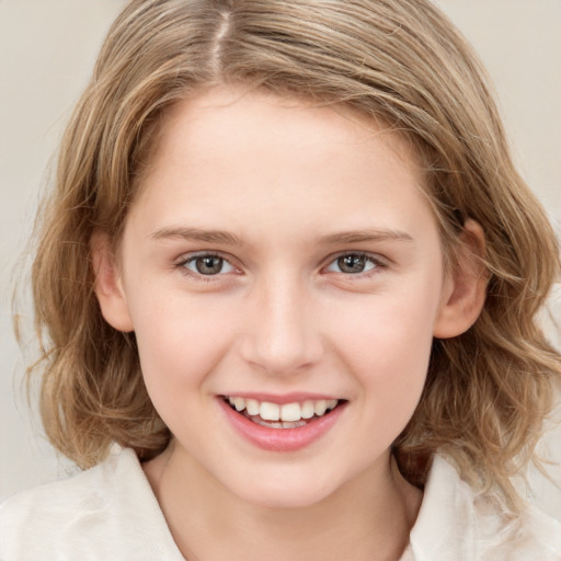 Joyful white child female with medium  brown hair and brown eyes