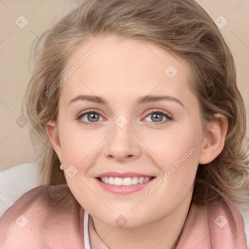 Joyful white young-adult female with medium  brown hair and blue eyes