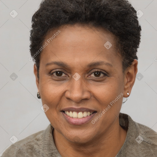 Joyful black adult female with short  brown hair and brown eyes