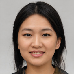 Joyful asian young-adult female with medium  black hair and brown eyes