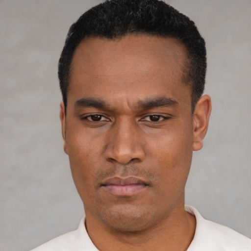 Neutral latino young-adult male with short  black hair and brown eyes