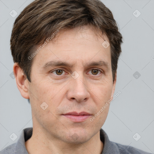 Neutral white adult male with short  brown hair and grey eyes