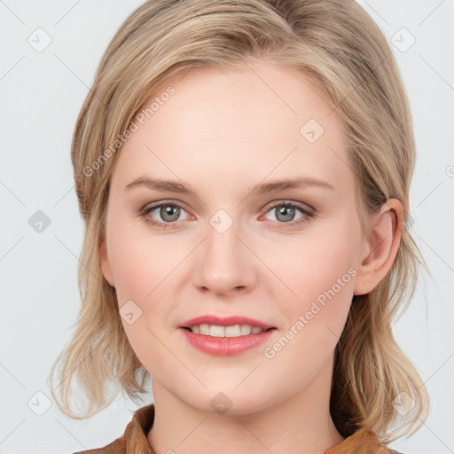 Joyful white young-adult female with medium  brown hair and blue eyes