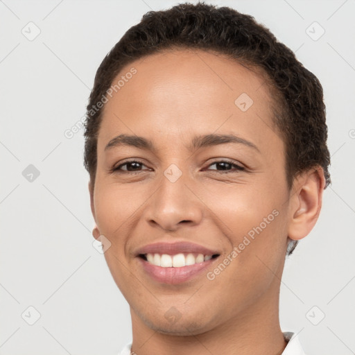 Joyful white young-adult female with short  brown hair and brown eyes