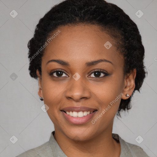 Joyful black young-adult female with medium  black hair and brown eyes