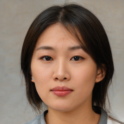 Neutral asian young-adult female with medium  brown hair and brown eyes