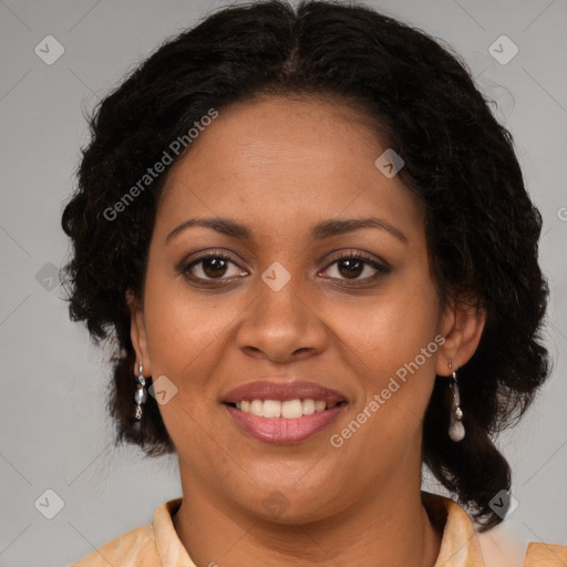 Joyful black adult female with medium  brown hair and brown eyes