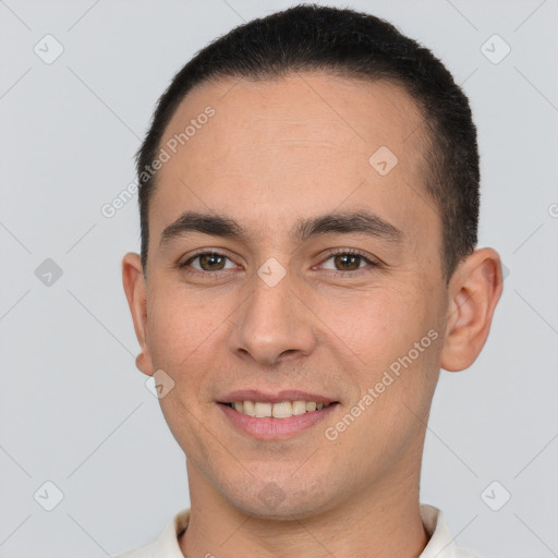 Joyful white young-adult male with short  brown hair and brown eyes