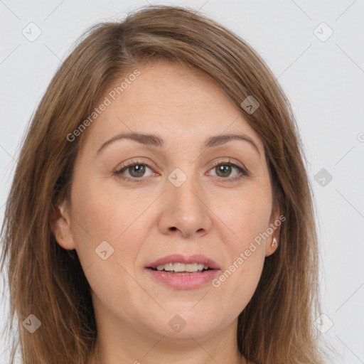 Joyful white adult female with long  brown hair and brown eyes