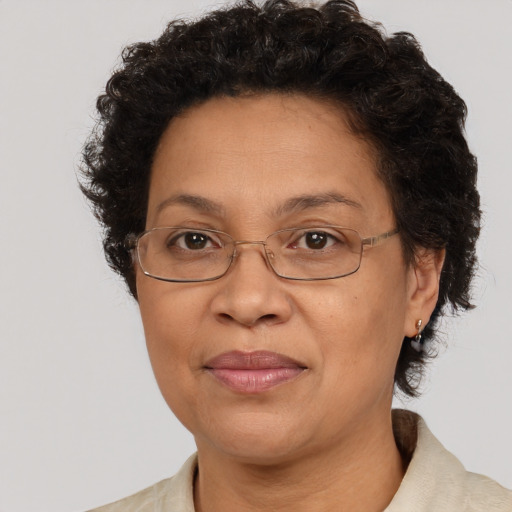 Joyful white adult female with short  brown hair and brown eyes