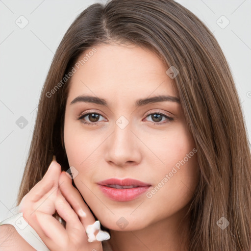 Neutral white young-adult female with long  brown hair and brown eyes