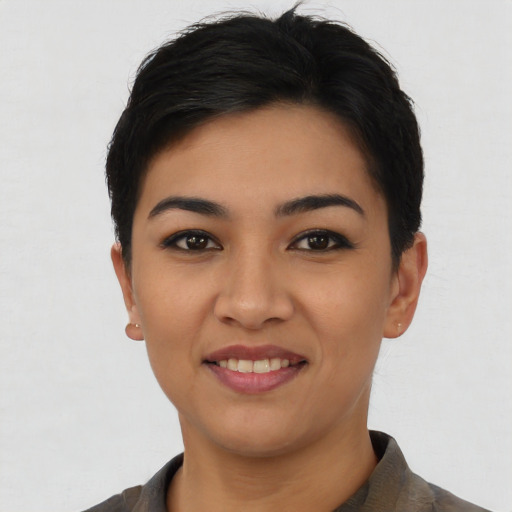 Joyful asian young-adult female with short  black hair and brown eyes