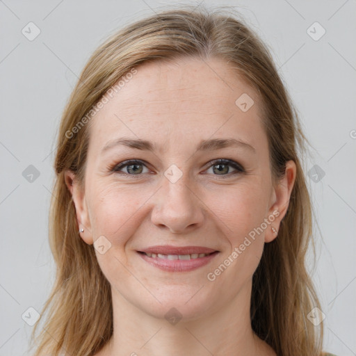 Joyful white young-adult female with long  brown hair and grey eyes