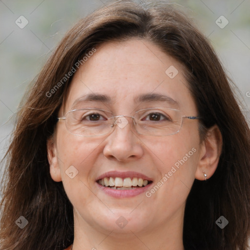 Joyful white adult female with long  brown hair and brown eyes