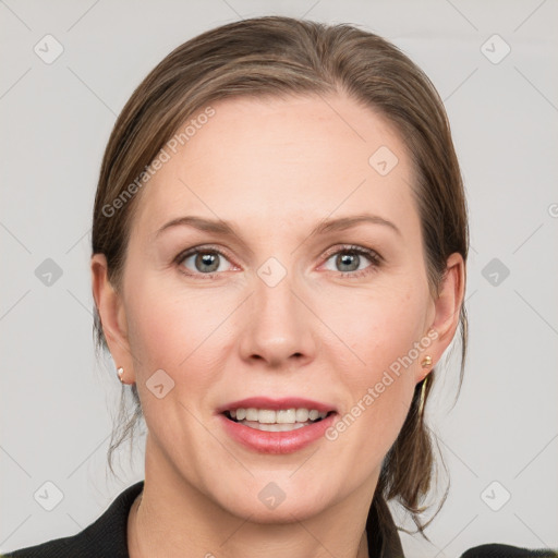 Joyful white adult female with medium  brown hair and grey eyes