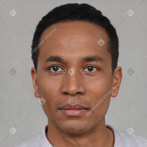 Neutral latino young-adult male with short  black hair and brown eyes