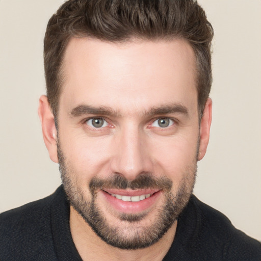 Joyful white young-adult male with short  brown hair and brown eyes