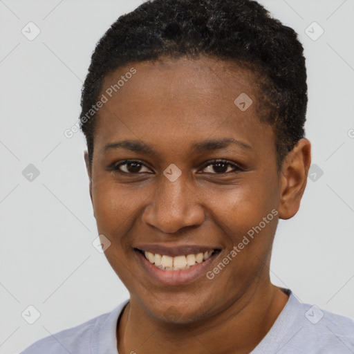 Joyful black young-adult female with short  brown hair and brown eyes