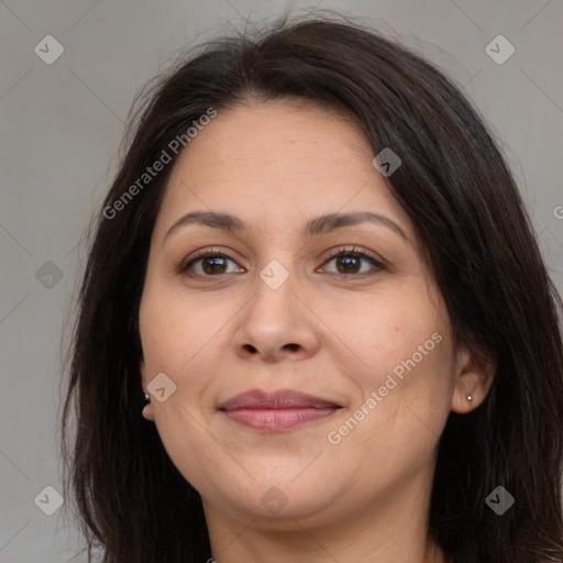 Joyful white adult female with long  brown hair and brown eyes