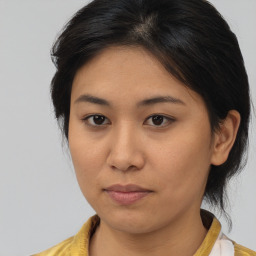 Neutral asian young-adult female with medium  brown hair and brown eyes