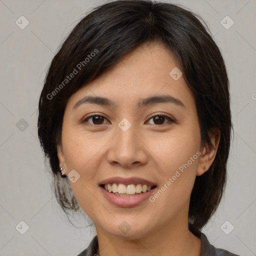 Joyful latino young-adult female with medium  brown hair and brown eyes