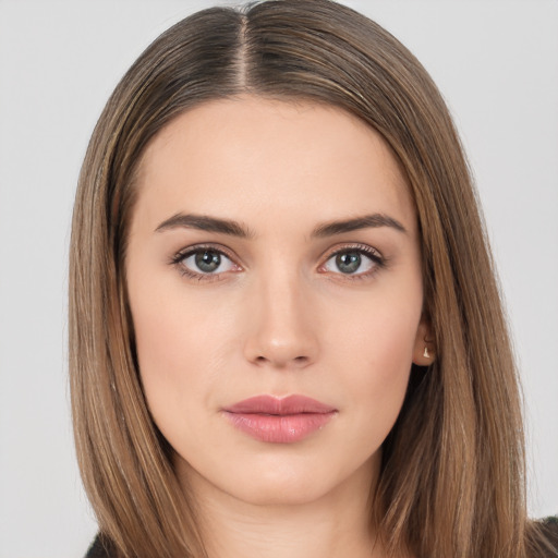 Neutral white young-adult female with long  brown hair and brown eyes