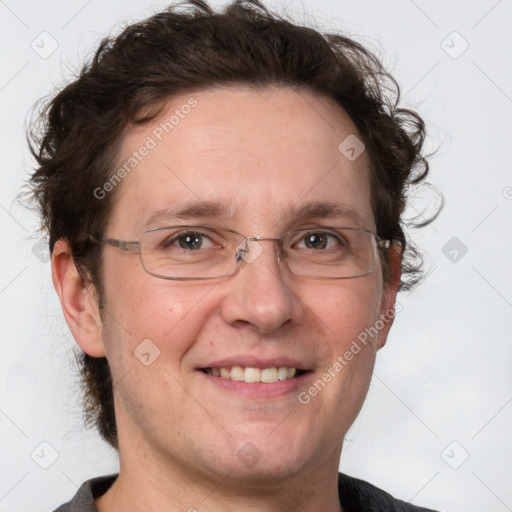 Joyful white adult male with short  brown hair and grey eyes