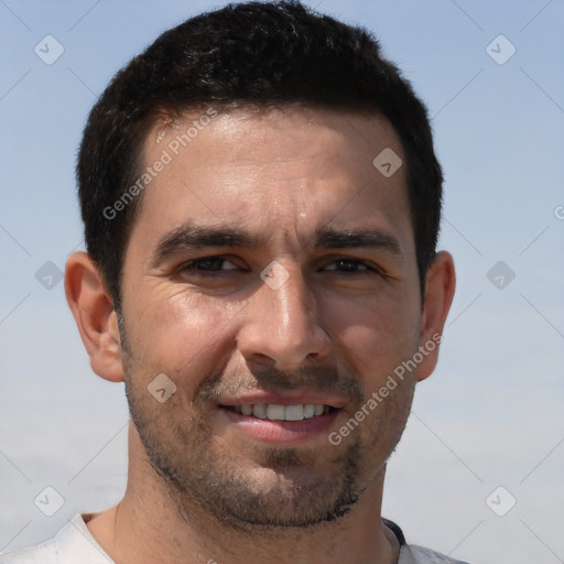 Joyful white adult male with short  brown hair and brown eyes