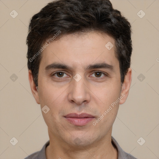 Joyful white young-adult male with short  black hair and brown eyes