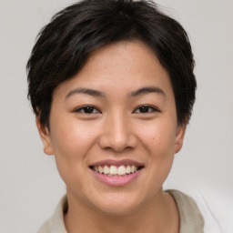 Joyful asian young-adult female with short  brown hair and brown eyes