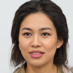 Joyful asian young-adult female with medium  brown hair and brown eyes