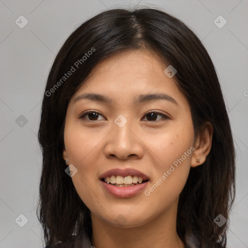 Joyful asian young-adult female with long  brown hair and brown eyes