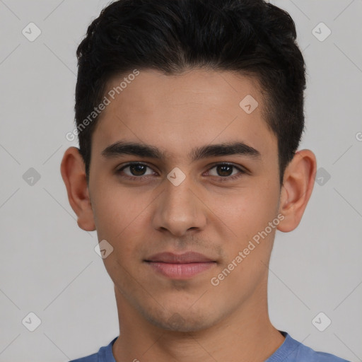 Joyful white young-adult male with short  black hair and brown eyes