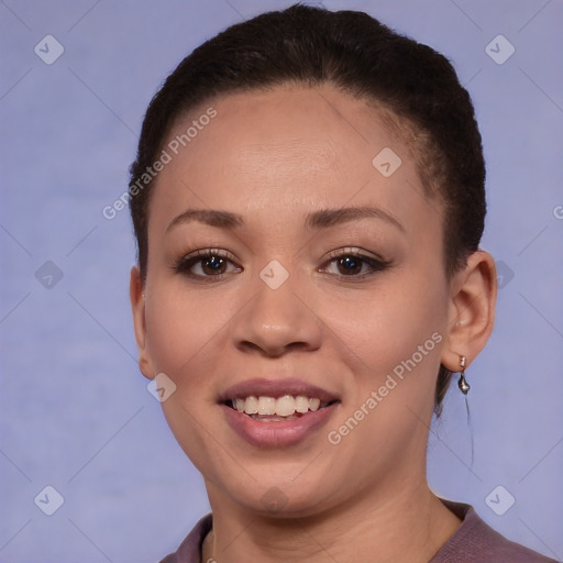 Joyful black young-adult female with short  brown hair and brown eyes