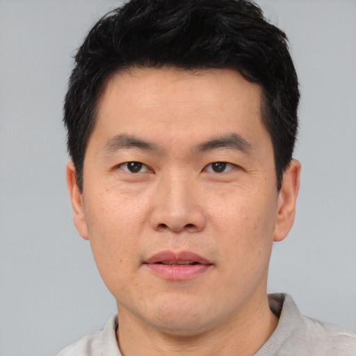 Neutral asian young-adult male with short  black hair and brown eyes
