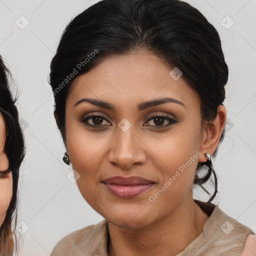 Joyful latino young-adult female with medium  brown hair and brown eyes