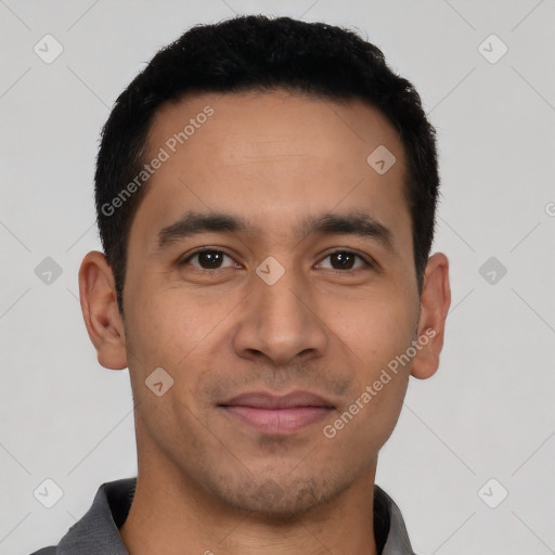 Joyful latino young-adult male with short  black hair and brown eyes