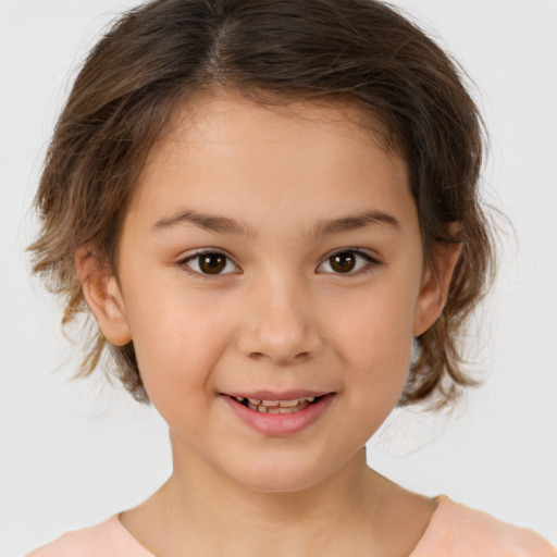 Joyful white child female with medium  brown hair and brown eyes