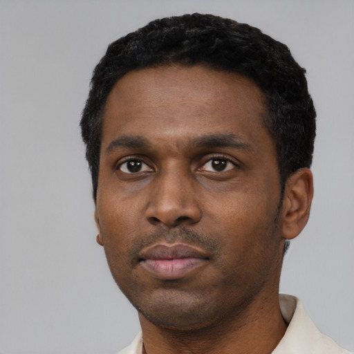 Neutral black young-adult male with short  black hair and brown eyes