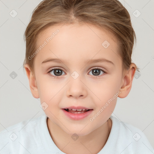 Joyful white child female with short  brown hair and brown eyes