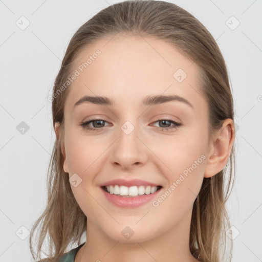 Joyful white young-adult female with long  brown hair and grey eyes