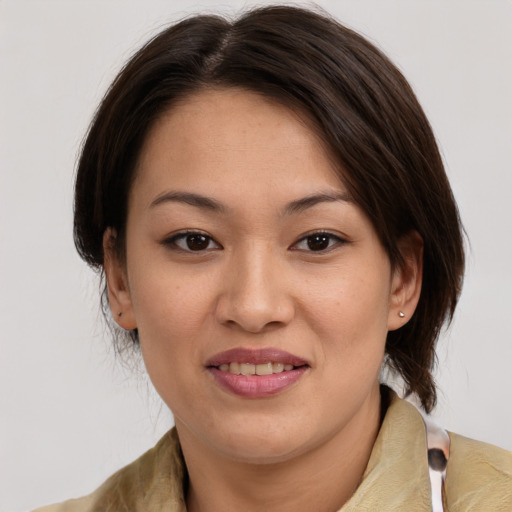 Joyful white young-adult female with medium  brown hair and brown eyes